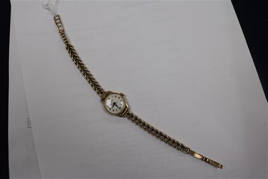 A ladys 1960s 9ct gold Tudor Royal manual wind wrist watch, on a 9ct gold bracelet.